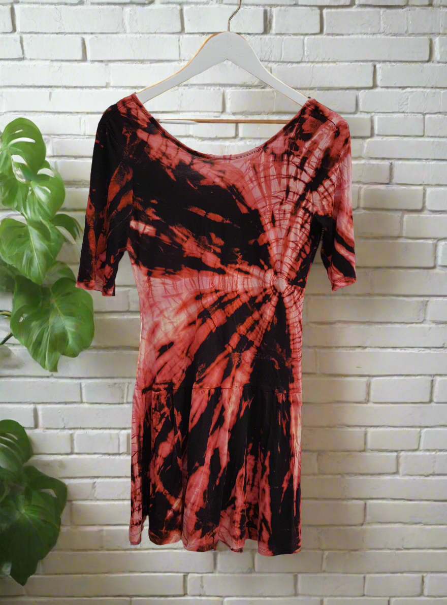 Unleash your inner fashionista with our Shibori style bleach dye mini dress, a stunning blend of upcycled design and bold artistry.