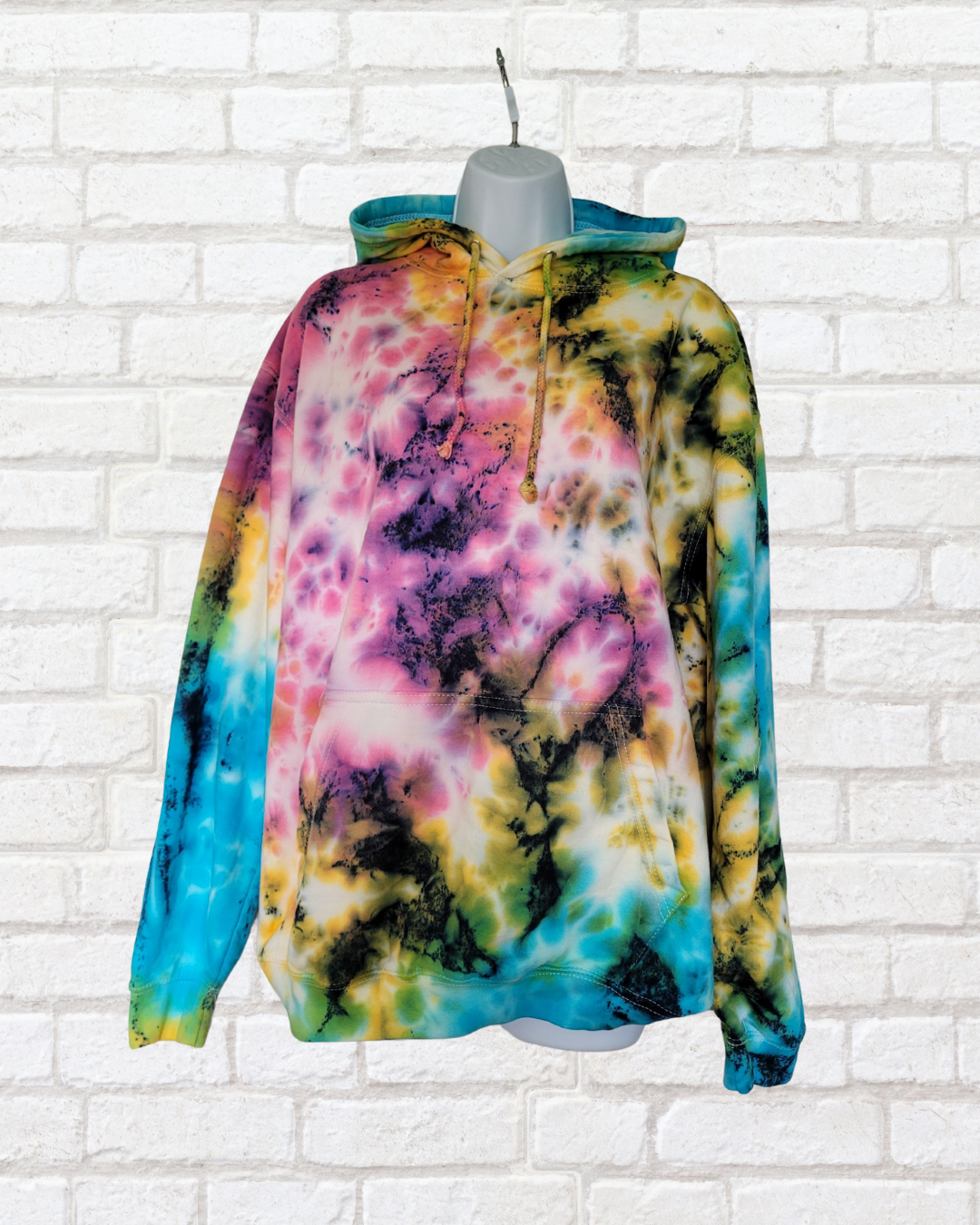 Take a risk and stand out from the summer festival crowds with our exclusive ethical scrunch tie dye hoodie!
Made from organic cotton, this hoodie boasts our most popular tie dye colourway in pink, blue, and yellow.