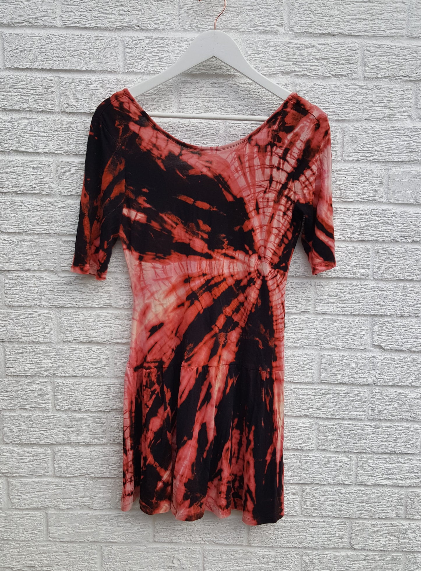 Bleached Shibori style tie dye dress in black & peach shades, jersey fabric mini dress with short sleeves and low back, to fit UK Size 10 or US size 6. This beautiful one of a kind dress was thrifted and upcycled in the UK, so it's not just one of a kind! It's also sustainable & friendly to the environment too! Hand dyed with love by AbiDashery. BE QUICK - THIS IS A ONE OFF UPCYCLE & THERE'S ONLY ONE AVAILABLE!