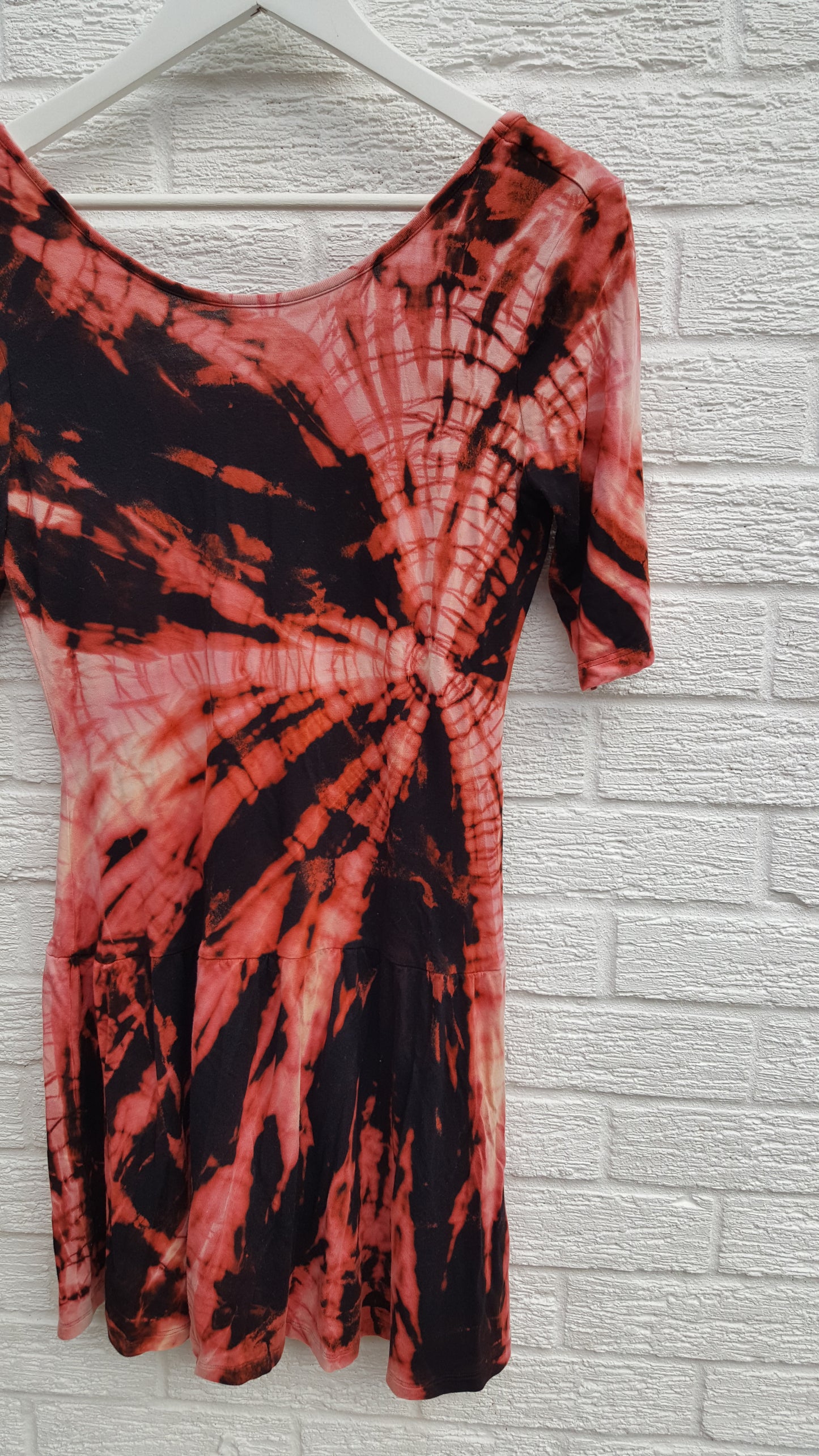 Bleached Shibori style tie dye dress in black & peach shades, jersey fabric mini dress with short sleeves and low back, to fit UK Size 10 or US size 6. This beautiful one of a kind dress was thrifted and upcycled in the UK, so it's not just one of a kind! It's also sustainable & friendly to the environment too! Hand dyed with love by AbiDashery. BE QUICK - THIS IS A ONE OFF UPCYCLE & THERE'S ONLY ONE AVAILABLE!