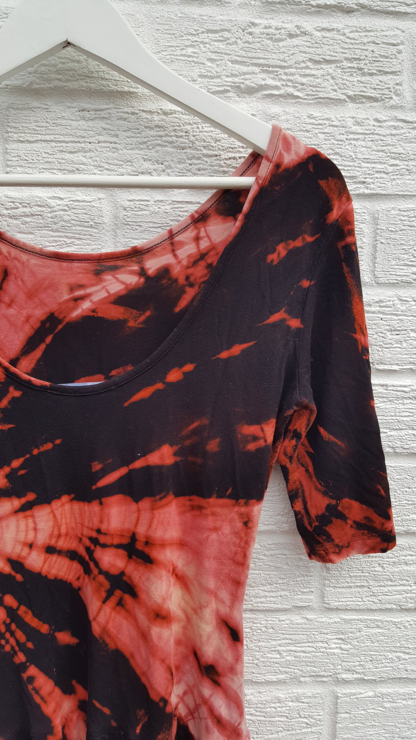 Bleached Shibori style tie dye dress in black & peach shades, jersey fabric mini dress with short sleeves and low back, to fit UK Size 10 or US size 6. This beautiful one of a kind dress was thrifted and upcycled in the UK, so it's not just one of a kind! It's also sustainable & friendly to the environment too! Hand dyed with love by AbiDashery. BE QUICK - THIS IS A ONE OFF UPCYCLE & THERE'S ONLY ONE AVAILABLE!