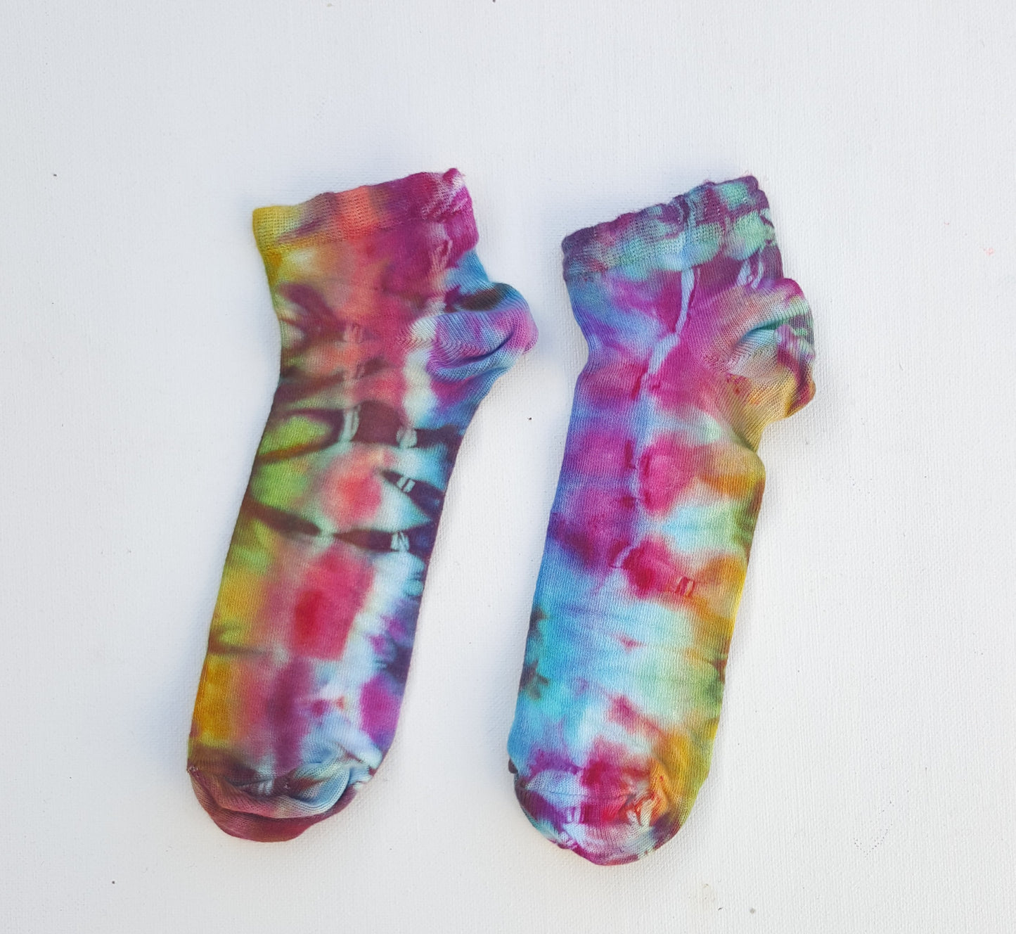 One pair of hand dyed bamboo trainer socks, in ice tie dye colours. Each is pair is unique and hand dyed with love, there's a huge variety of colours available and a pair will be chosen at random for you, each pair is unique and hand dyed! Made with natural organic bamboo fibres, light and breathable. 80% bamboo, 17% polyamide, 3% elastane . To fit women's size UK 4-8 - EUR 37-42 - US 6-10