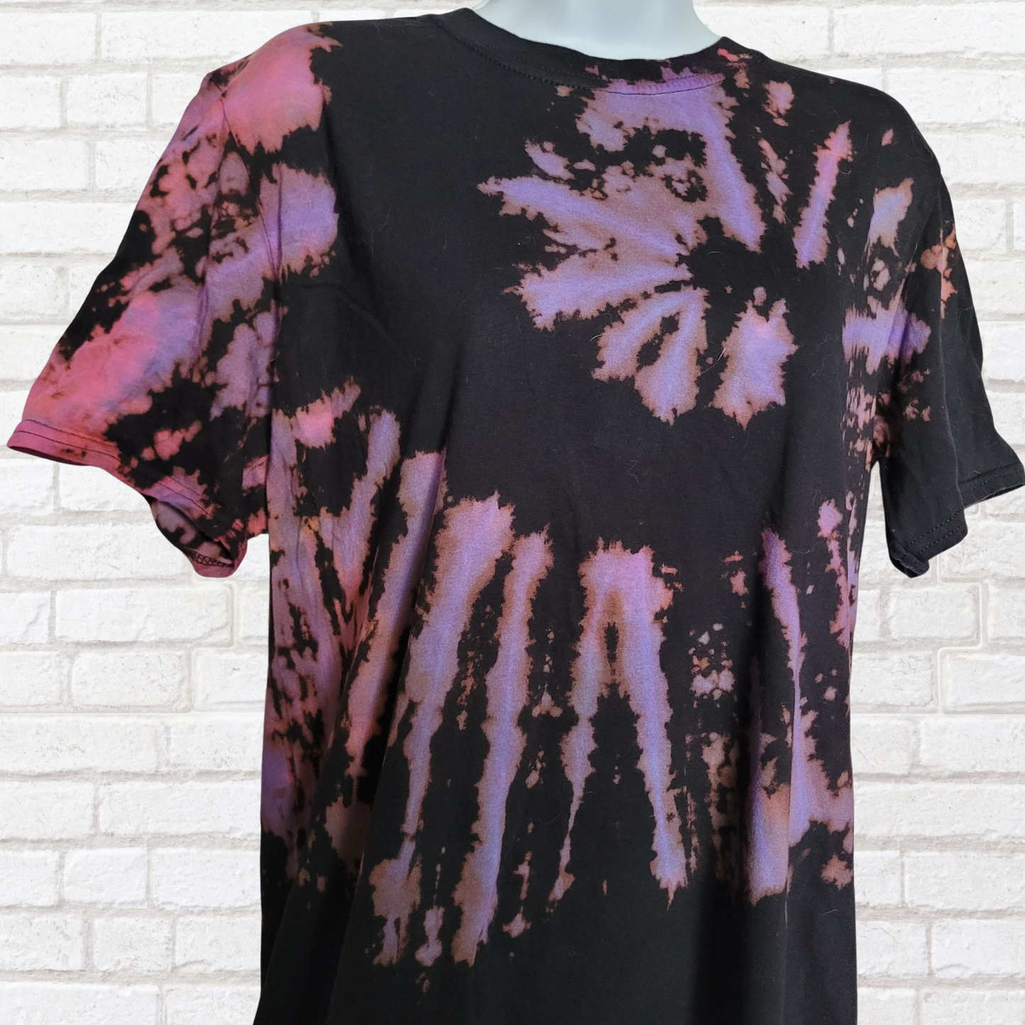 AbiDashery black and purple tie-dye t-shirt on a mannequin against a white wall — Third Eye Chakra Collection
