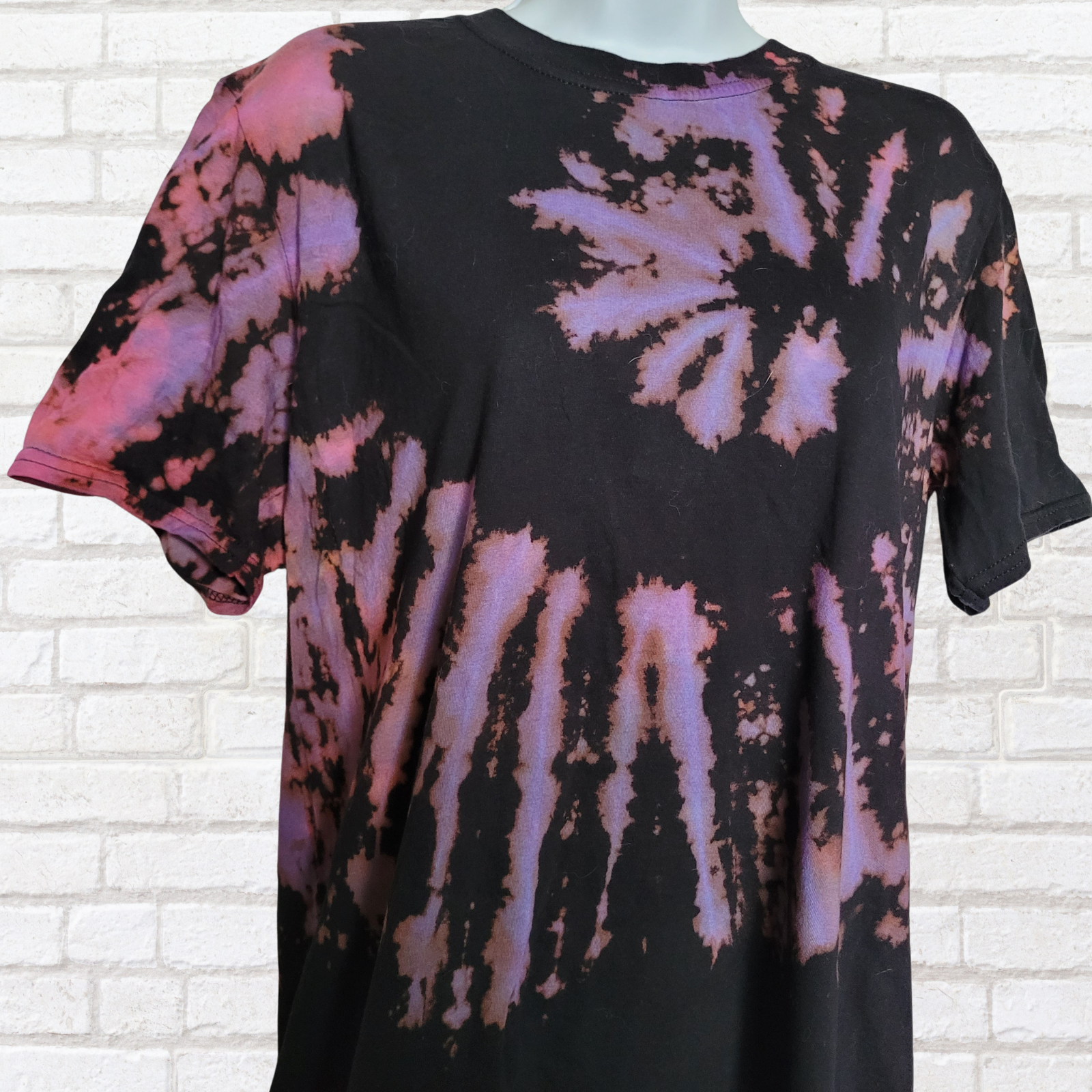 AbiDashery black and purple tie-dye t-shirt on a mannequin against a white wall — Third Eye Chakra Collection
