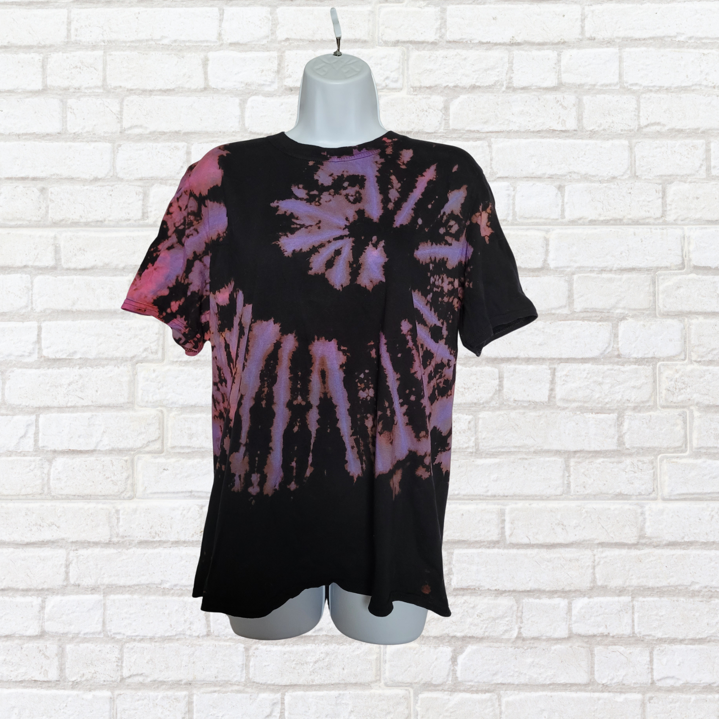 AbiDashery black and purple tie-dye t-shirt on a mannequin against a white wall — Third Eye Chakra Collection
