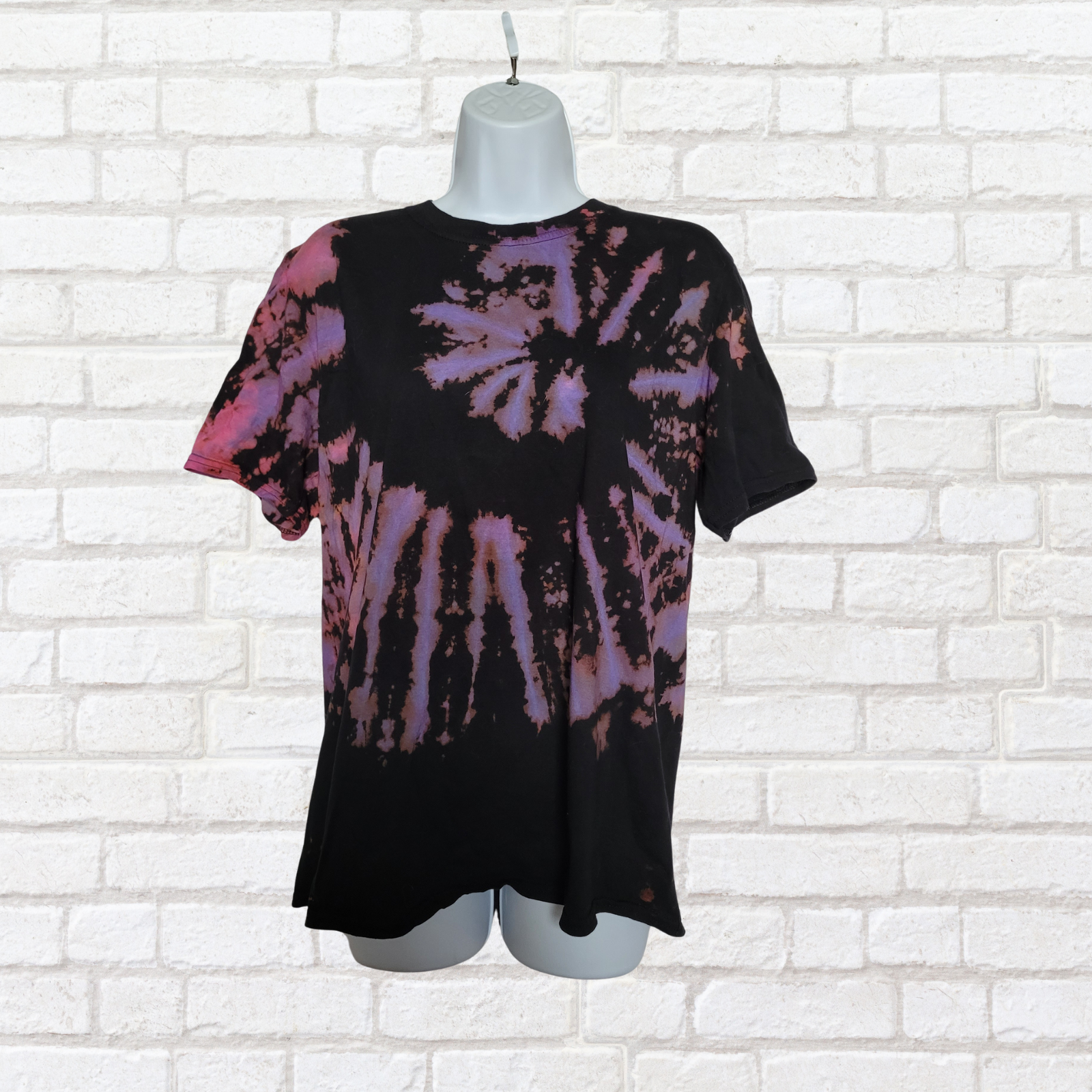 AbiDashery black and purple tie-dye t-shirt on a mannequin against a white wall — Third Eye Chakra Collection

