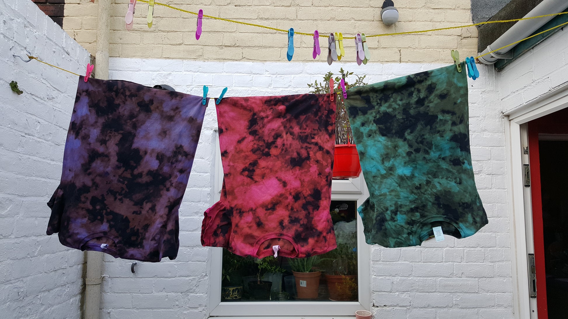 selection of bleach dyed shirts