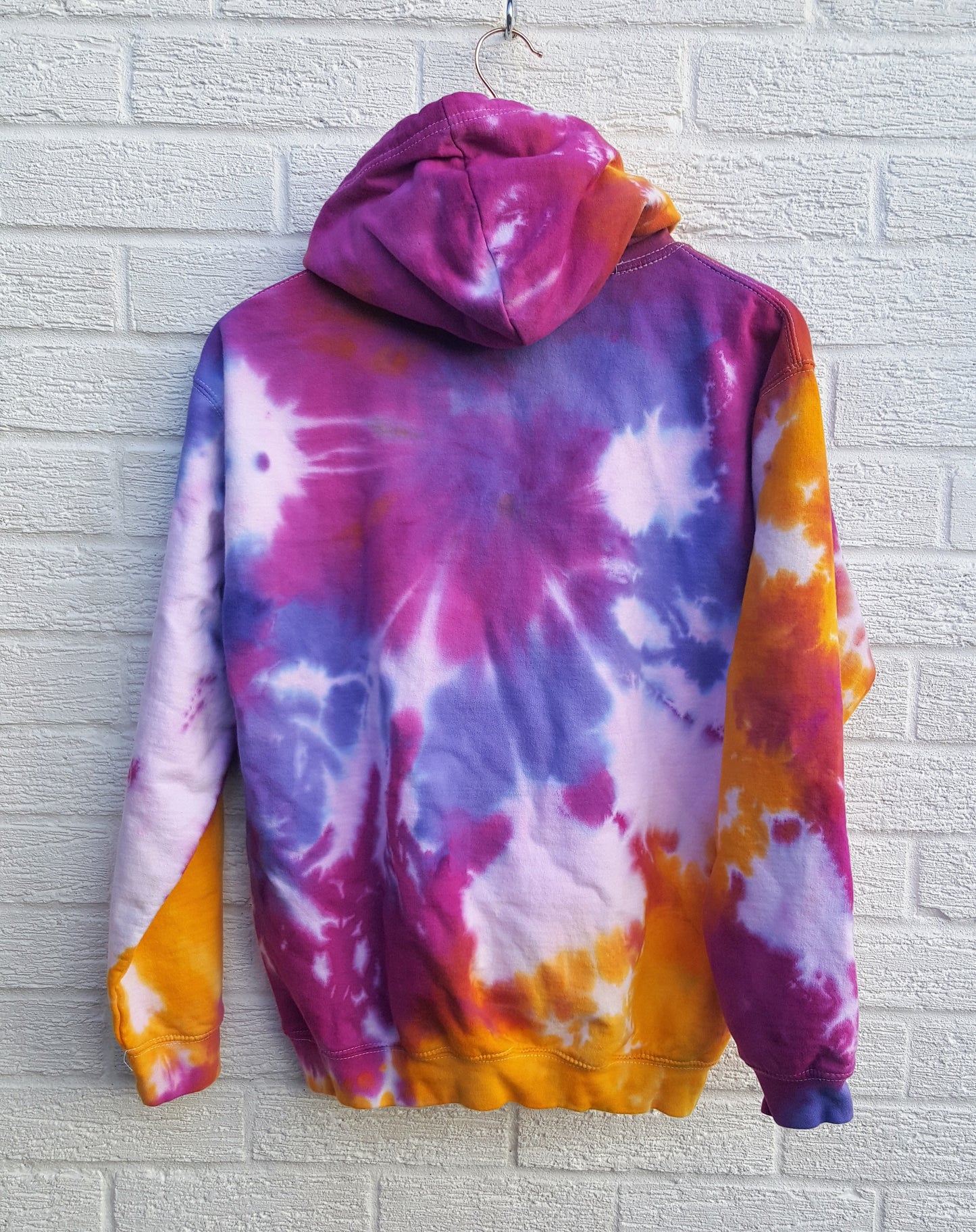 Tie dye hoodie, in orange, pink & purple shades, the perfect colourful cover up for the coming festive season, in men's/unisex sizes.  These one of a kind hoodies are hand dyed to order, in 80% Organic Cotton, 20% Recycled Polyester, double fabric hood, front pouch pocket, ribbed cuffs and hem.  Hand dyed in the UK by AbiDashery.