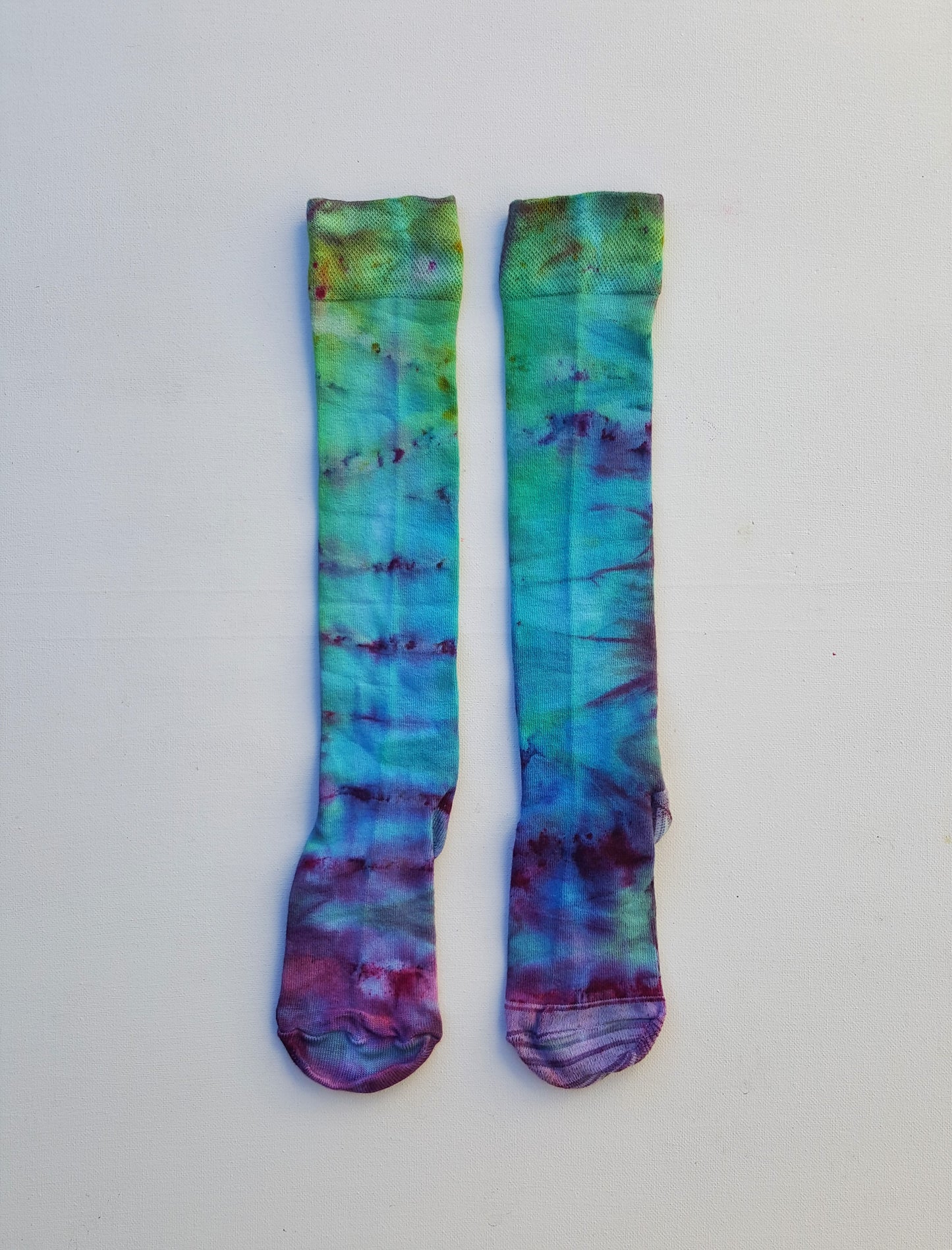 One pair of hand dyed bamboo knee high socks, in ice tie dye colours. Each is pair is unique and hand dyed with love, several colour options available.  Made with natural organic bamboo fibres, light and breathable. 80% bamboo, 17% polyamide, 3% elastane .  To fit women's size UK 4-8 - EUR 37-42 - US 6-10