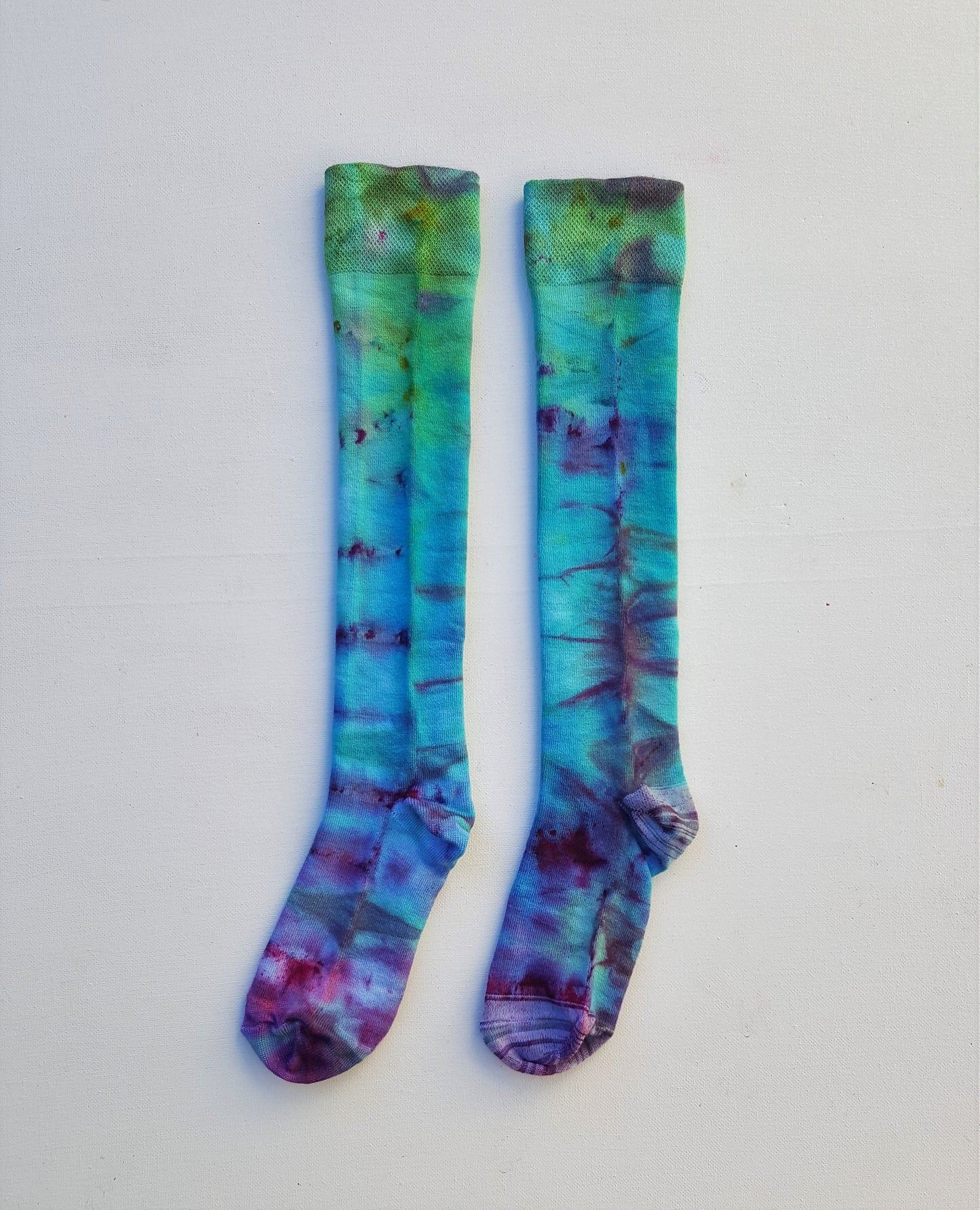 One pair of hand dyed bamboo knee high socks, in ice tie dye colours. Each is pair is unique and hand dyed with love, several colour options available.  Made with natural organic bamboo fibres, light and breathable. 80% bamboo, 17% polyamide, 3% elastane .  To fit women's size UK 4-8 - EUR 37-42 - US 6-10