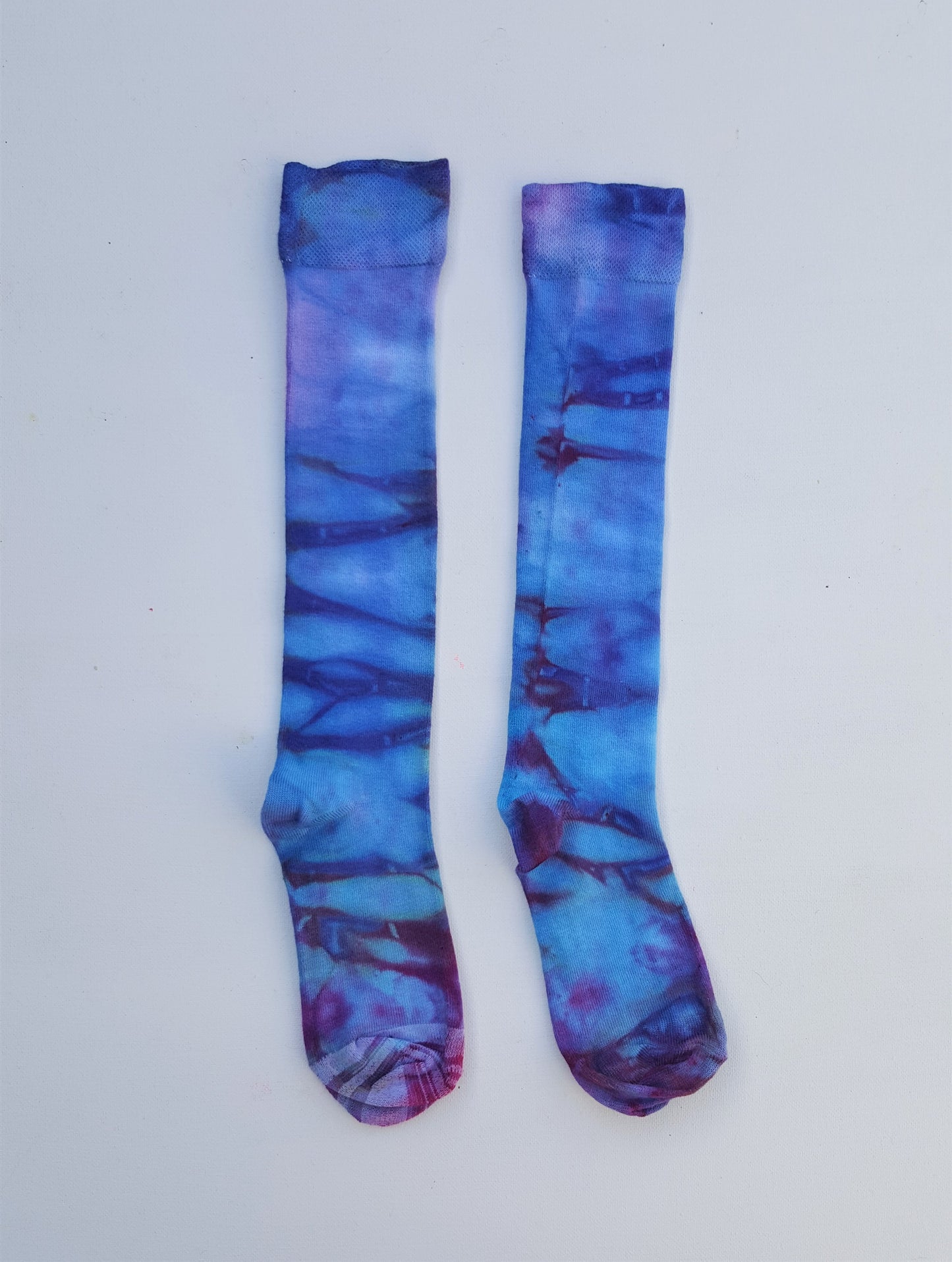 One pair of hand dyed bamboo knee high socks, in ice tie dye colours. Each is pair is unique and hand dyed with love, several colour options available.  Made with natural organic bamboo fibres, light and breathable. 80% bamboo, 17% polyamide, 3% elastane .  To fit women's size UK 4-8 - EUR 37-42 - US 6-10